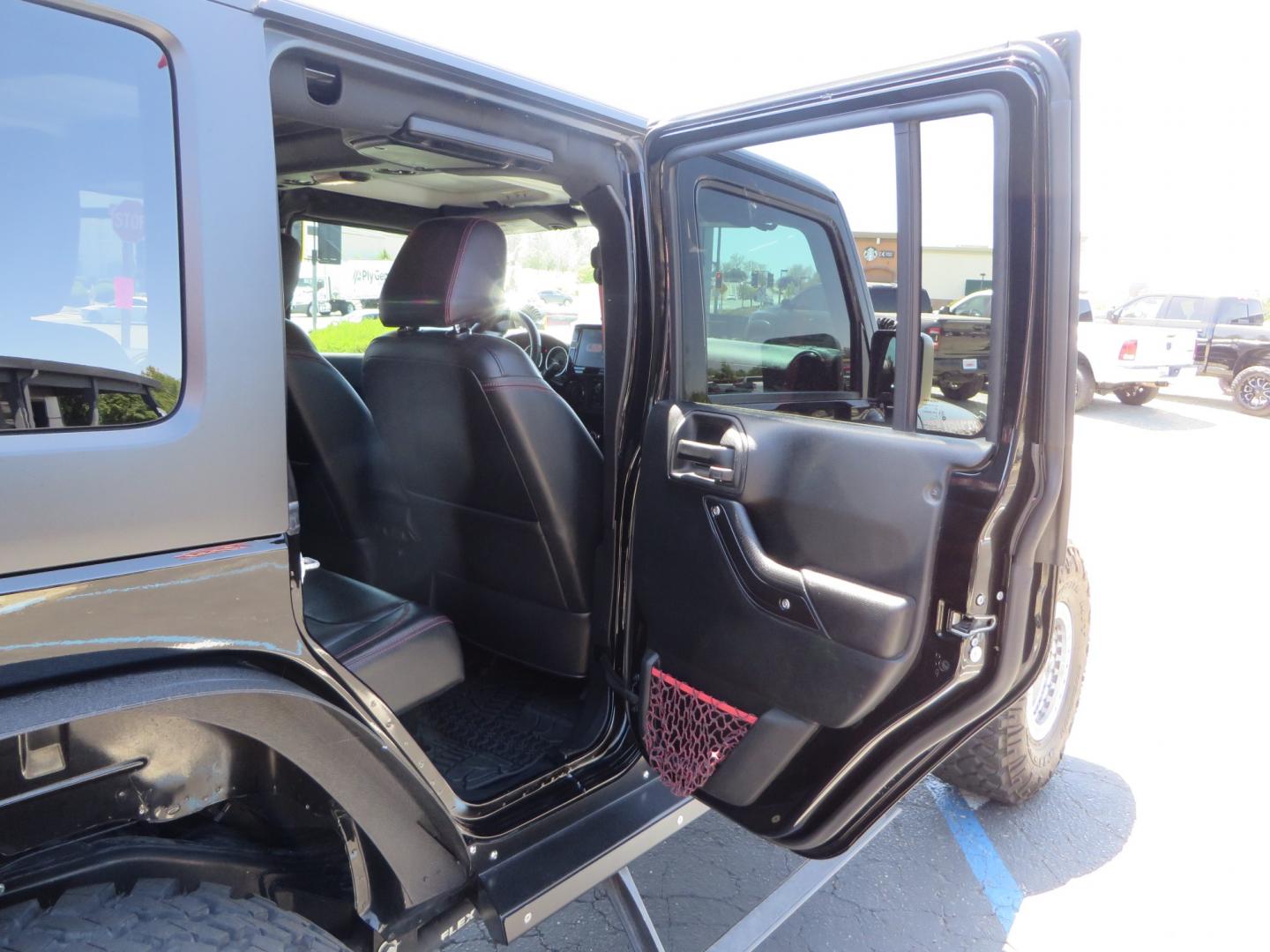 2017 BLACK /BLACK Jeep Wrangler Unlimited Rubicon 4WD (1C4BJWFG5HL) with an 392 Hemi Swapped engine, located at 2630 Grass Valley Highway, Auburn, CA, 95603, (530) 508-5100, 38.937893, -121.095482 - !!!!!!!!!!! NOT FOR SALE IN CA !!!!!!!!!!!!!! 392 Hemi swapped JK with a ton of extras...... Teraflex Long arm suspension system, Fox 2.0 remote reservoir shocks, Fox ATS steering stabilizer, Teraflex bump stops, Limit straps, Adams front and rear drivelines, Teraflex exhuast spacer, Dakota Custo - Photo#65